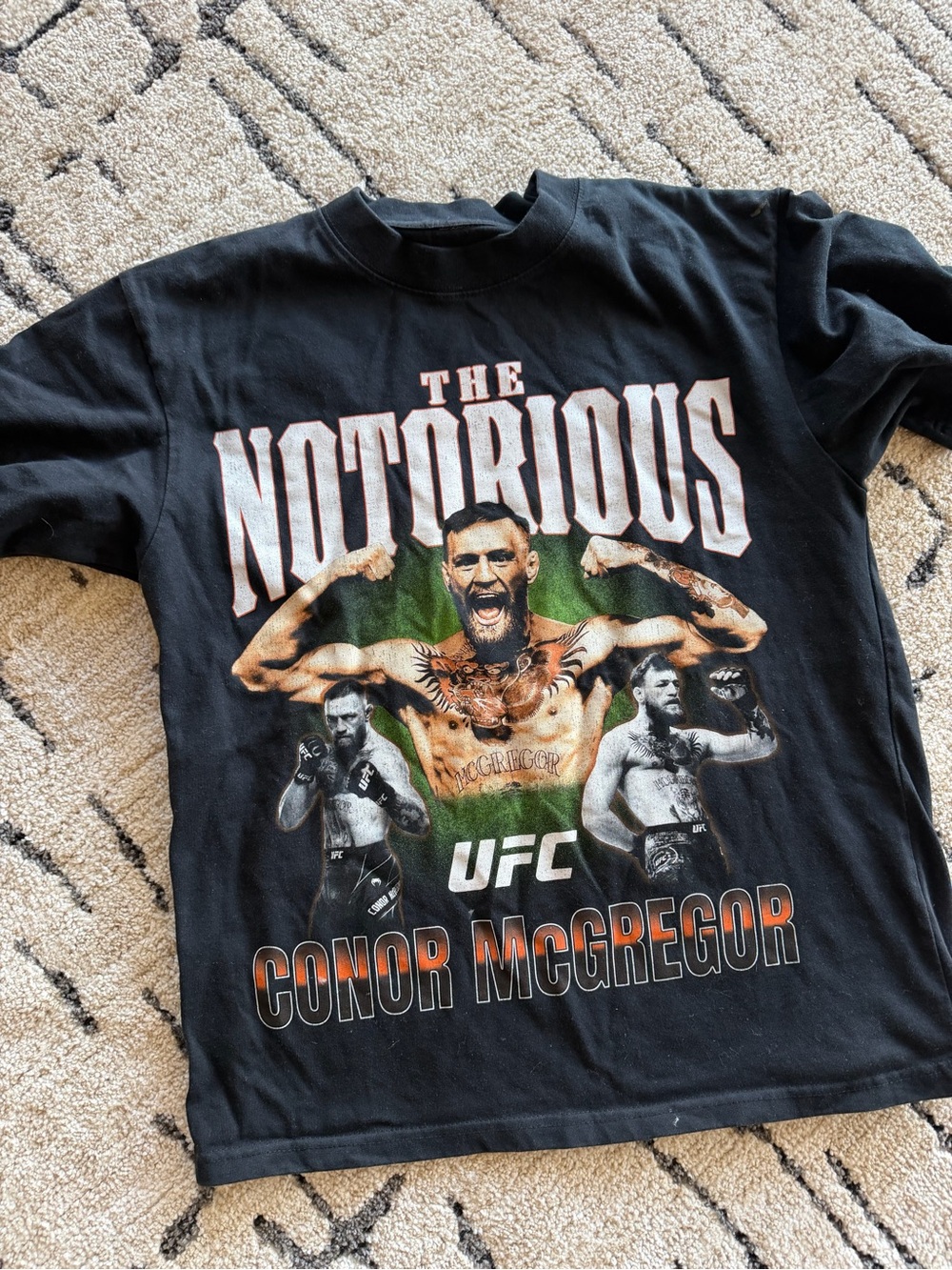 Black Conor McGregor UFC graphic T-shirt featuring a large vintage-inspired